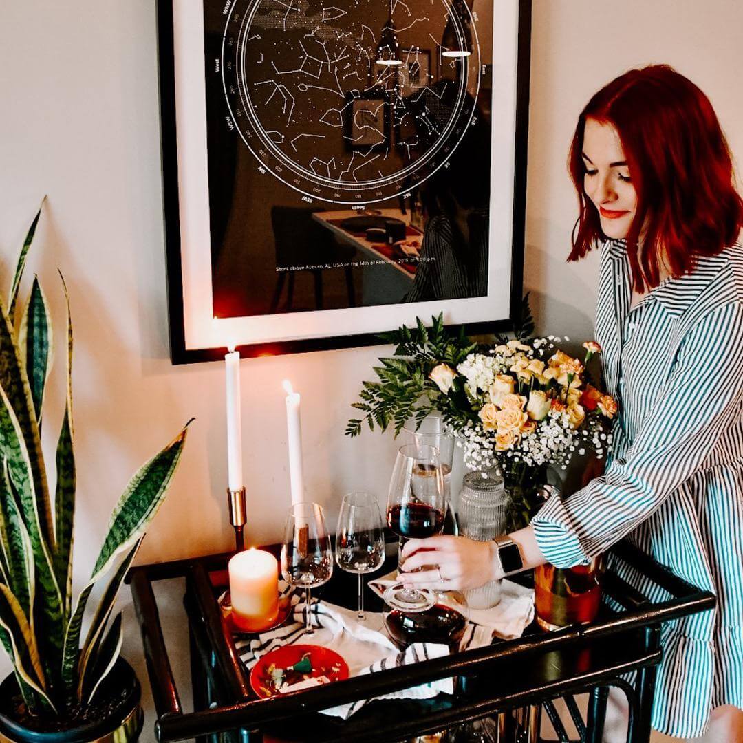 Lady organizing things on a desk with a Star Map Placed on it